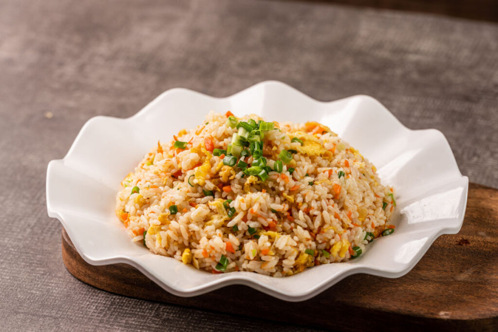 Fried rice in a white dish.